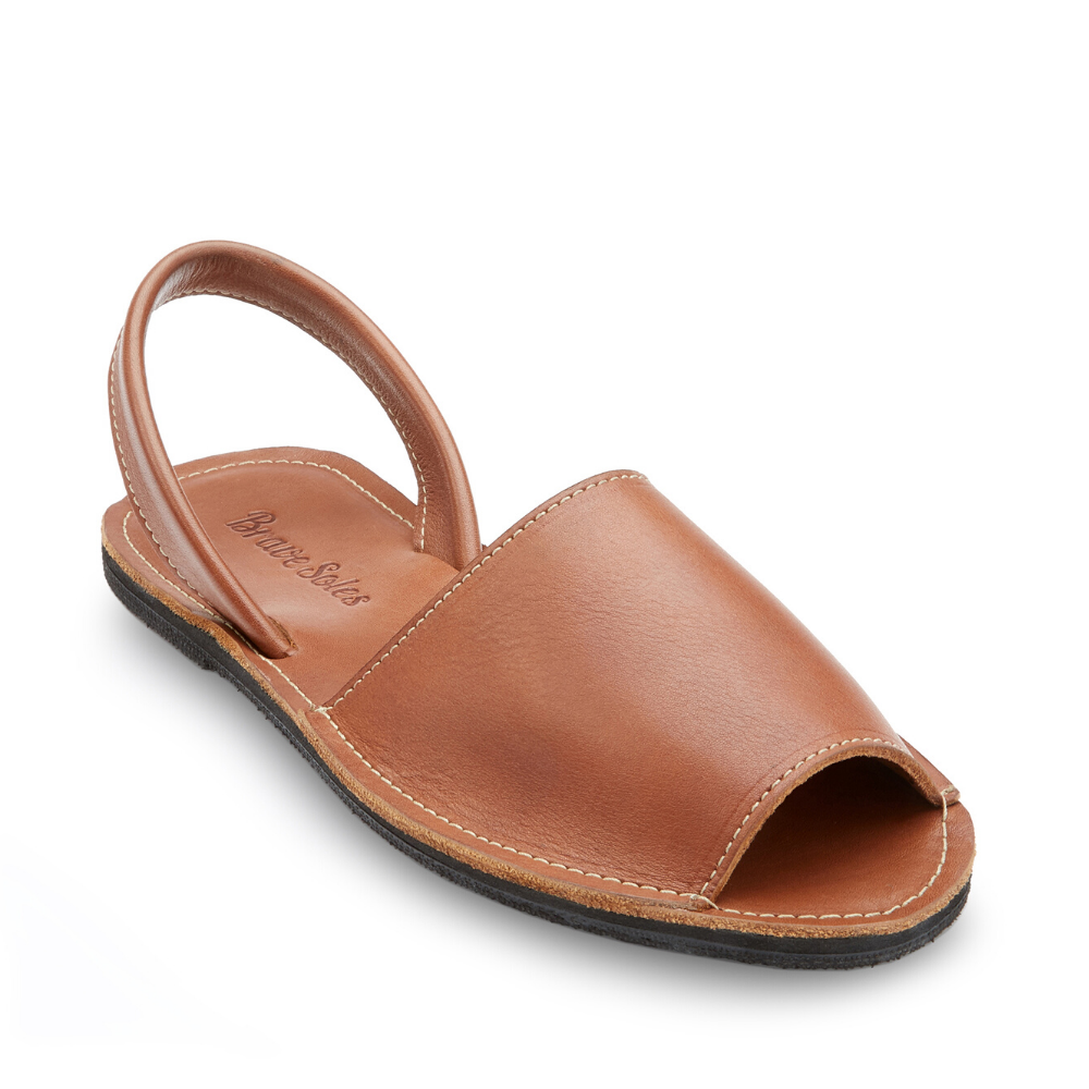 The Miina Caramel Avarca Sandal: Classic caramel leather Avarca sandal with secure ankle strap and cushioned sole for all-day comfort and style.