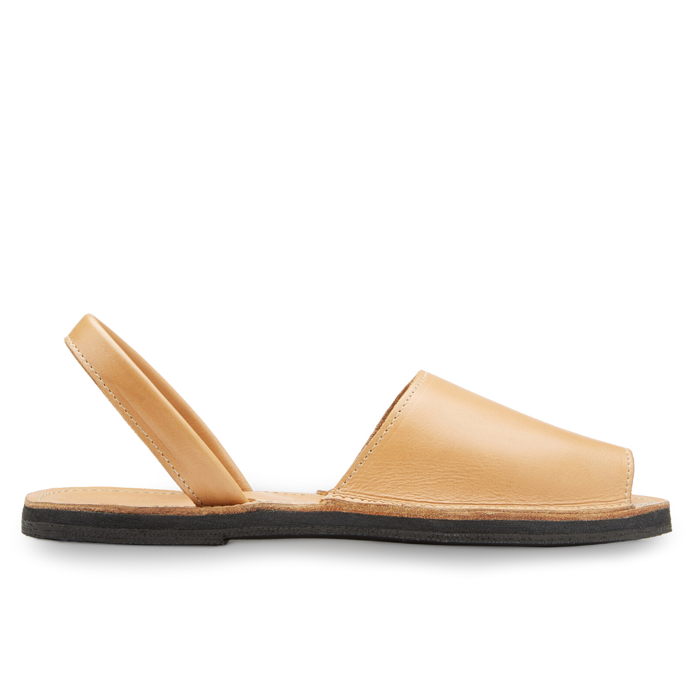 The Miina Natural Avarca Sandal: Simple natural leather Avarca sandal with secure ankle strap and cushioned sole, blending comfort with versatility.