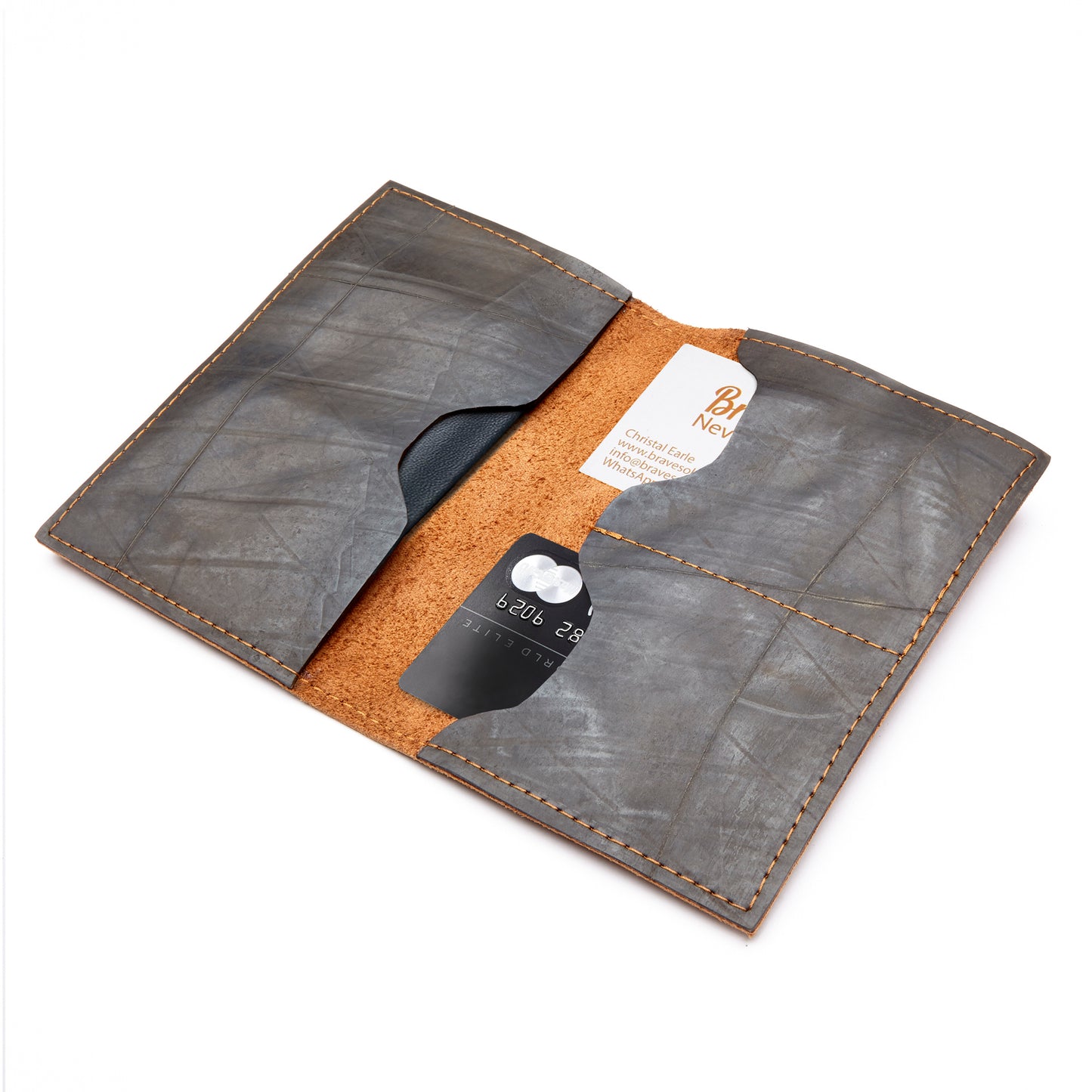 Showcasing the miina viajero opened up showing cards and passport.