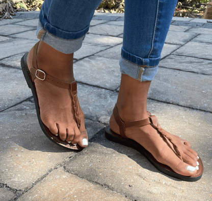 Brave Soles Bonita sandals on model's feet walking on sidewalk