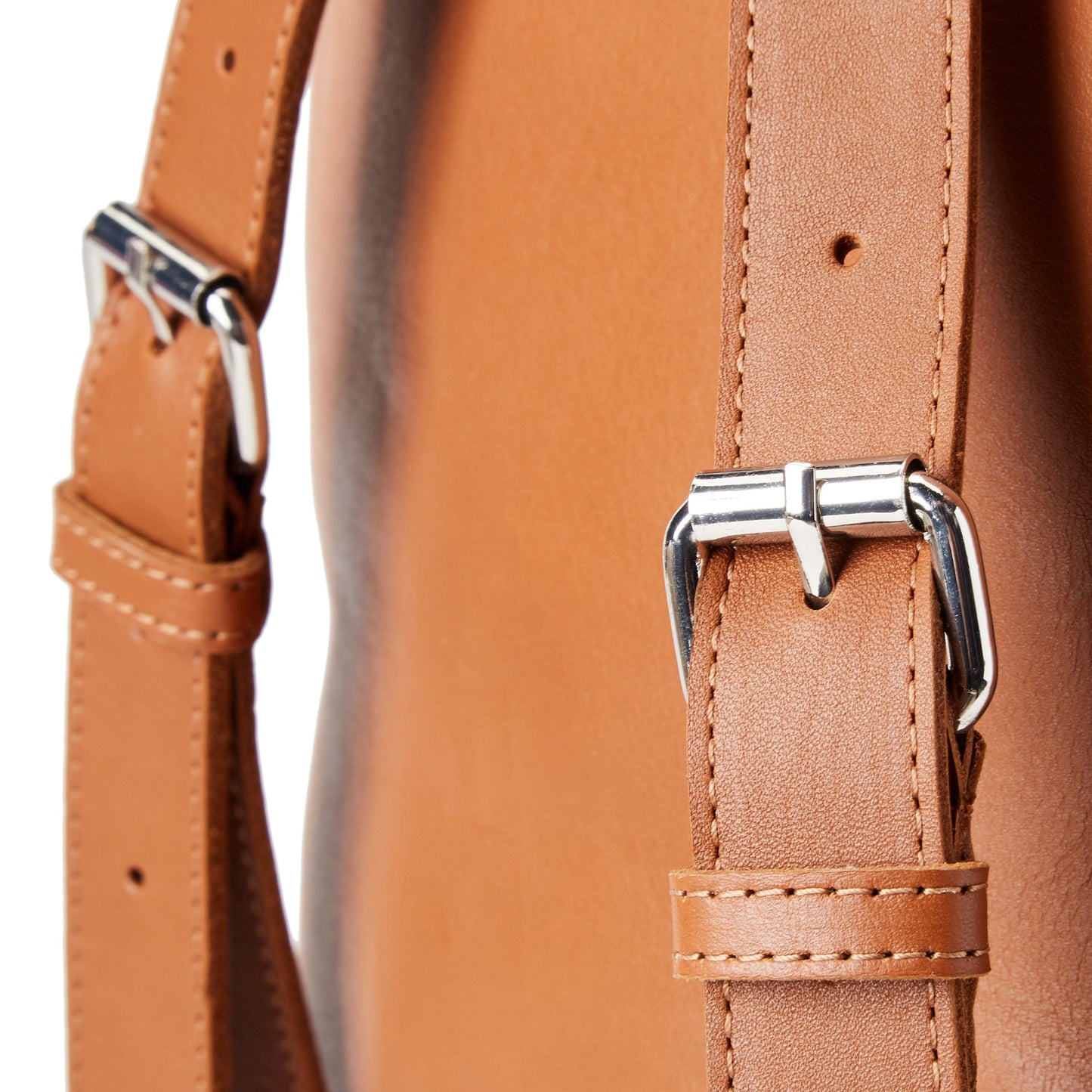 a close up of the Miina Camino Caramel backpack straps.