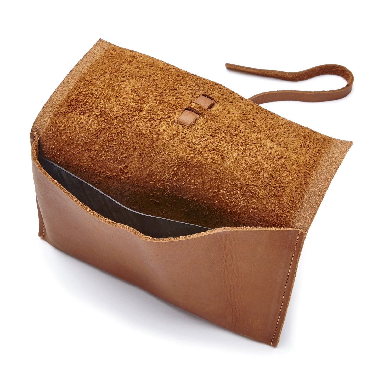 The Miina Sandra caramel Close-up of the interior of the Leather Pouch, highlighting its roomy compartment ideal for small essentials like keys, cards, or makeup.