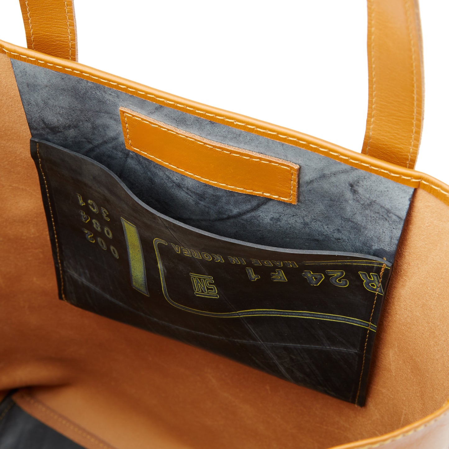 Upclose of the inside of the Miina Jessica leather tote bag