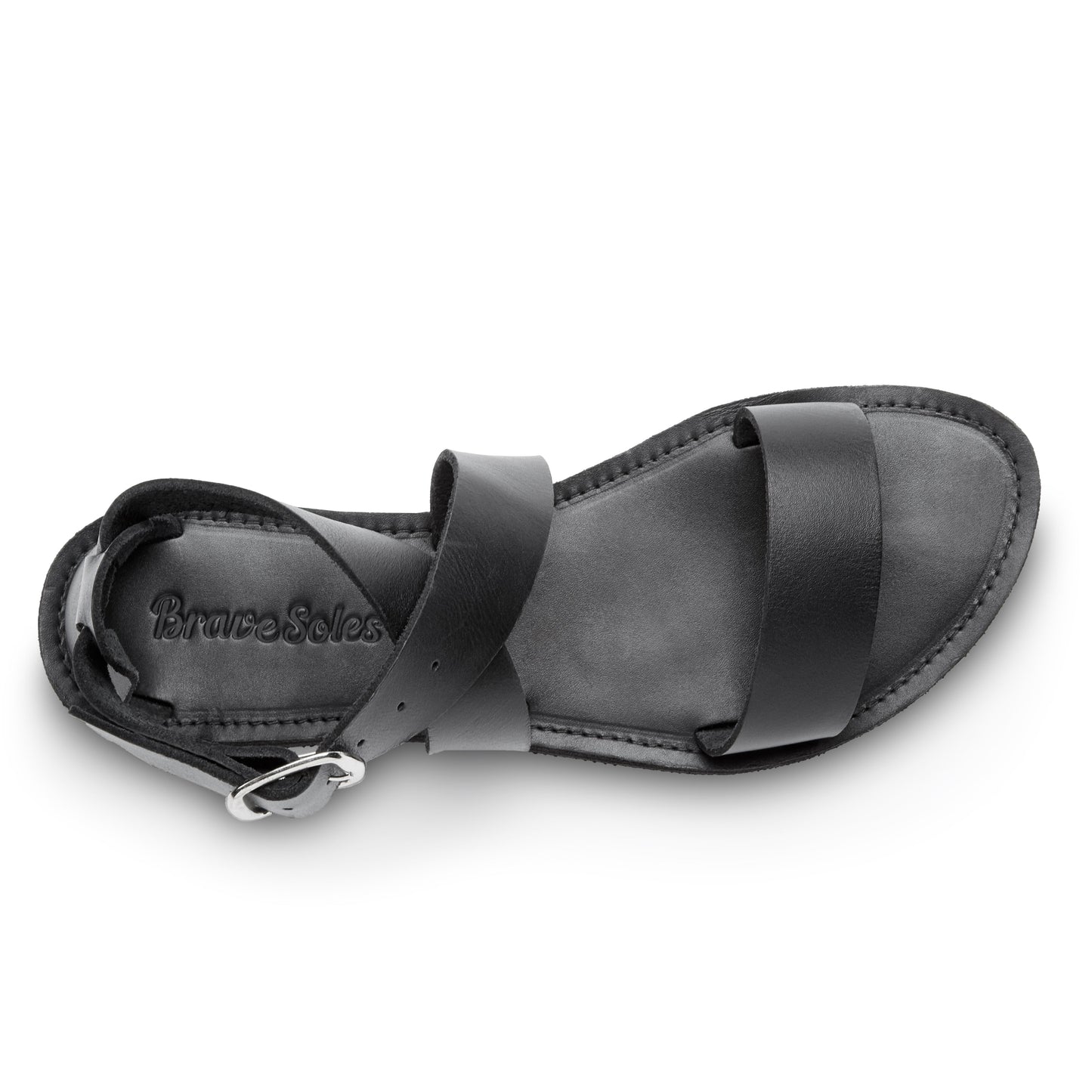 The Miina Jasmine All-Black Leather Sandal: Classic black leather sandal with minimalist cross-ankle design and cushioned sole for stylish comfort.