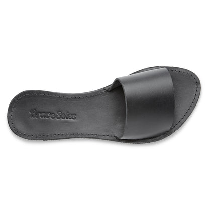 The miina Black Linda Slide: Classic black leather slide with cushioned sole, combining simplicity and elegance for any look.