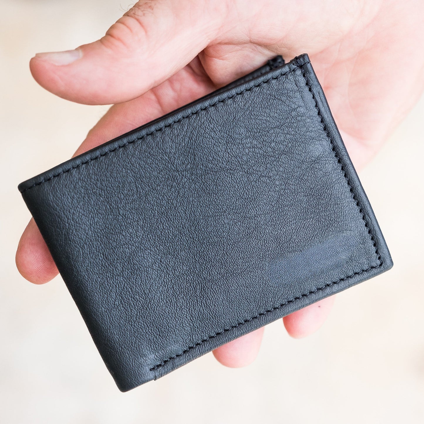 Man holding the Miina michel bifold wallet