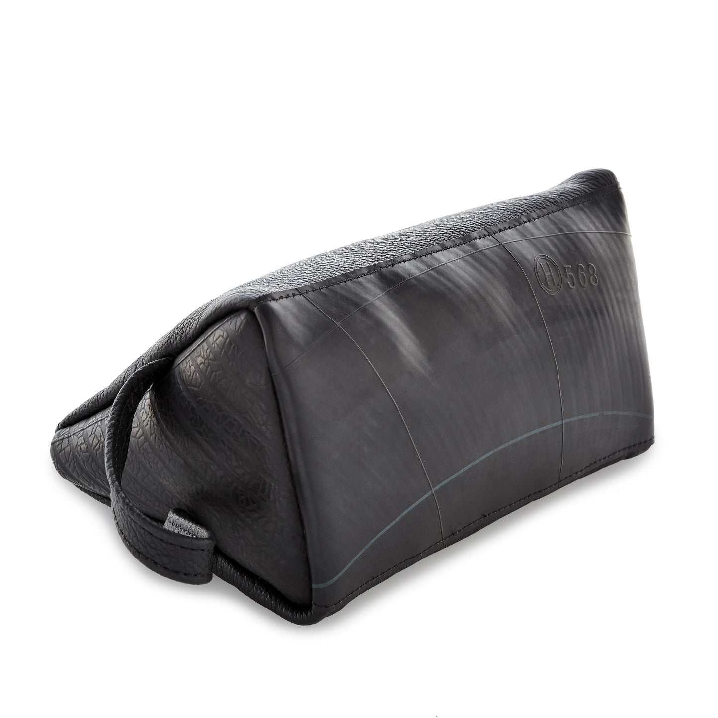 Bottom view of the Miina Leather Toiletry Bag, highlighting its sturdy base and durable construction.
