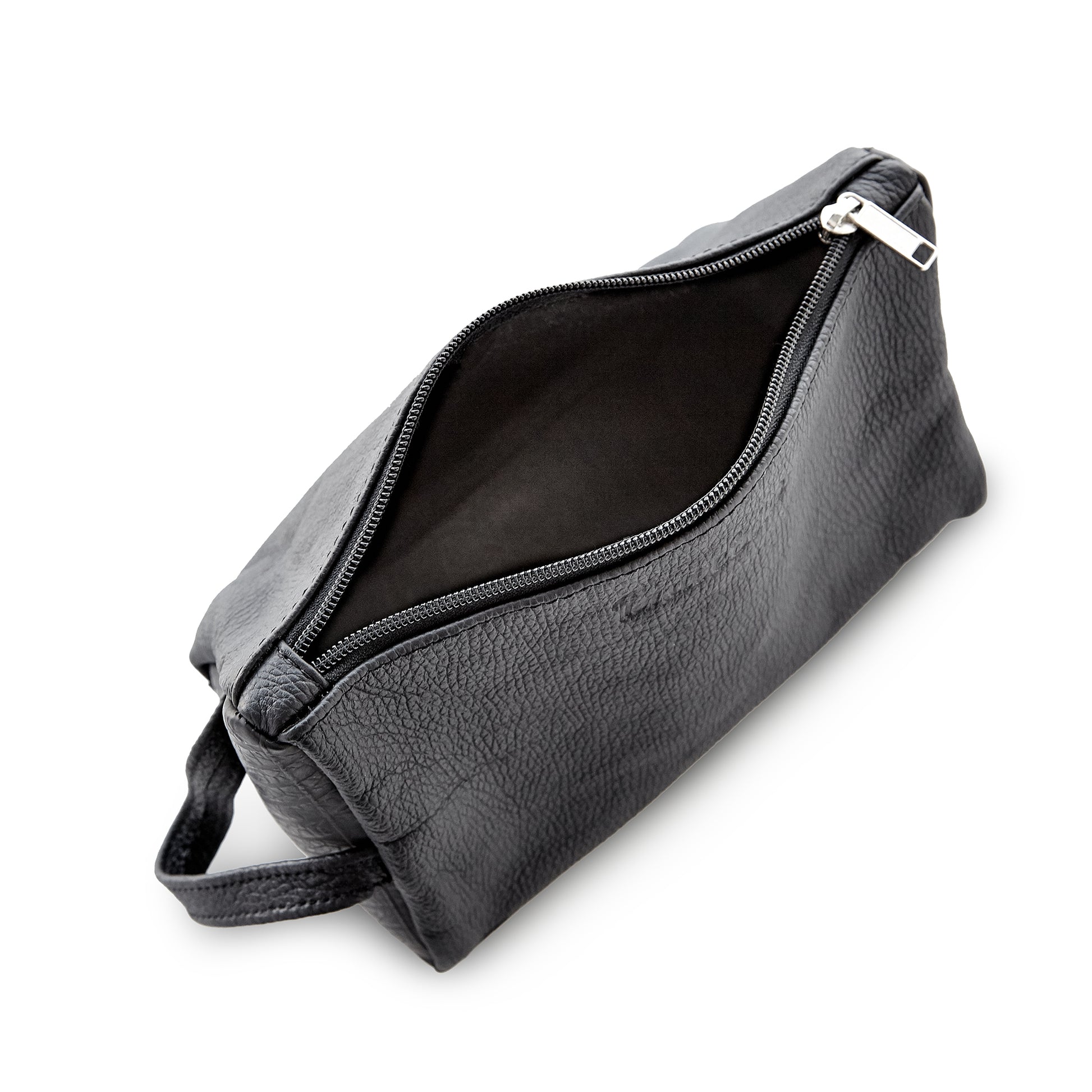 Interior view of the Miina Leather Toiletry Bag, revealing its spacious compartment ideal for organizing toiletries and travel essentials.