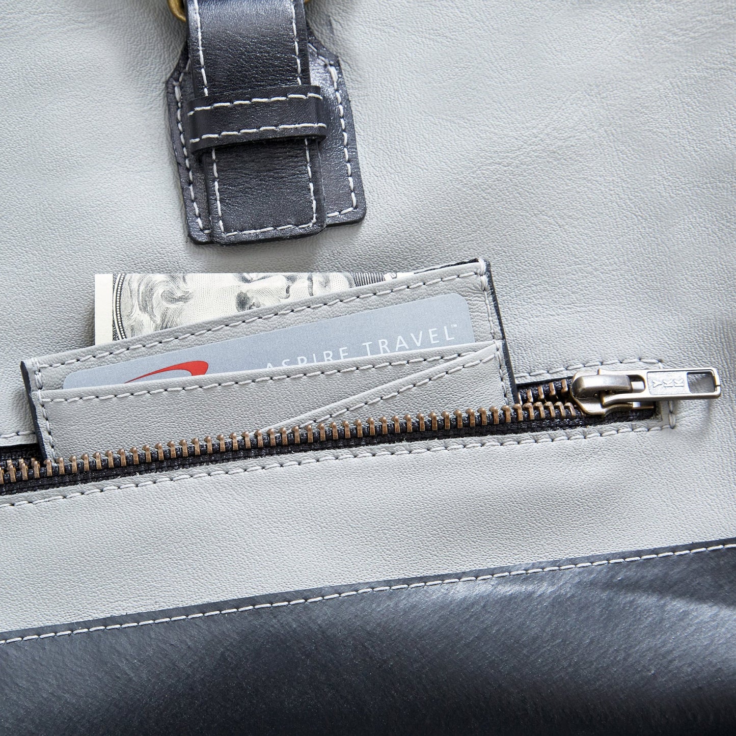 Closer front view of The Miina Hudson messenger bag made with grey upcycled aircraft leather