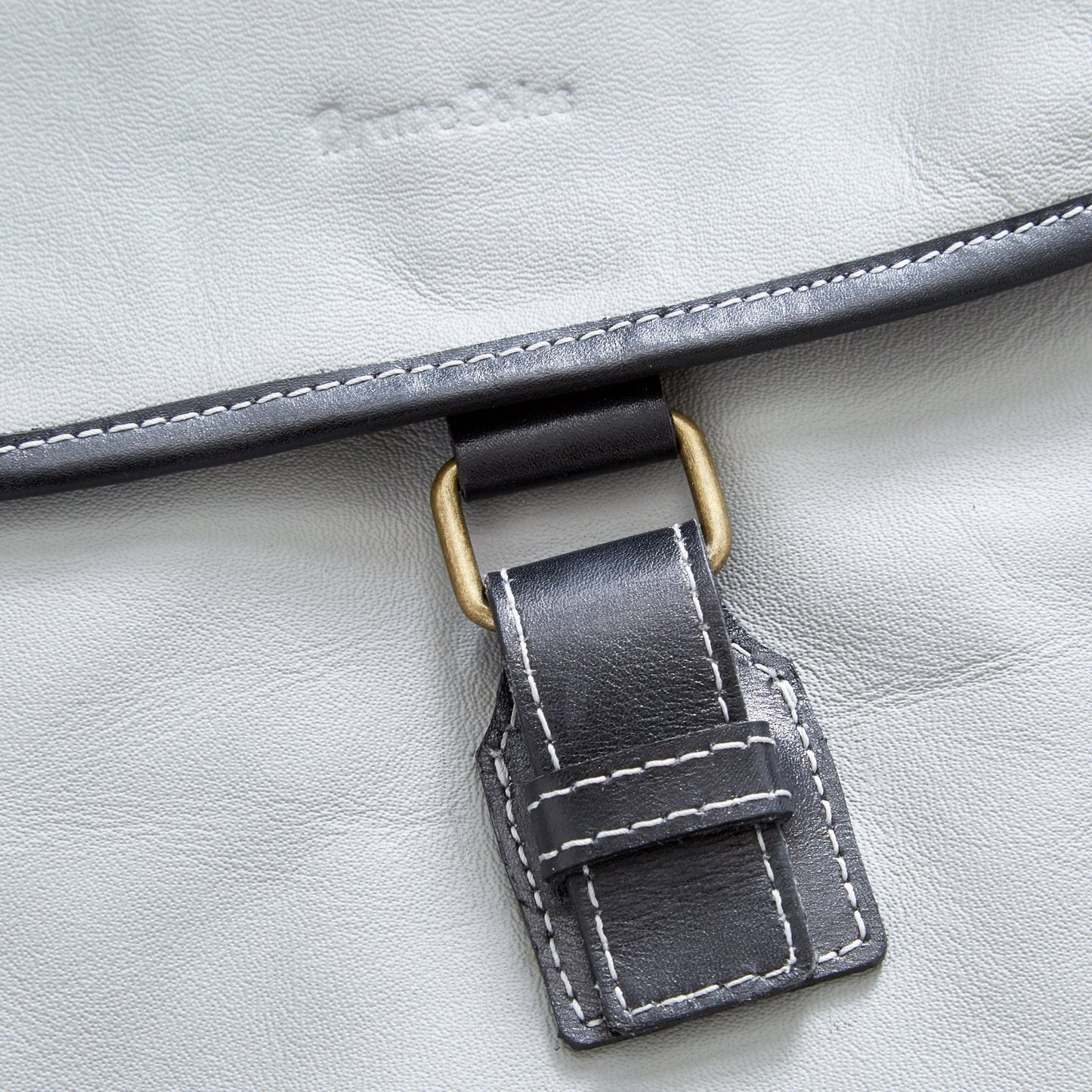 Closer view of The Miina Hudson messenger bag made with grey upcycled aircraft leather