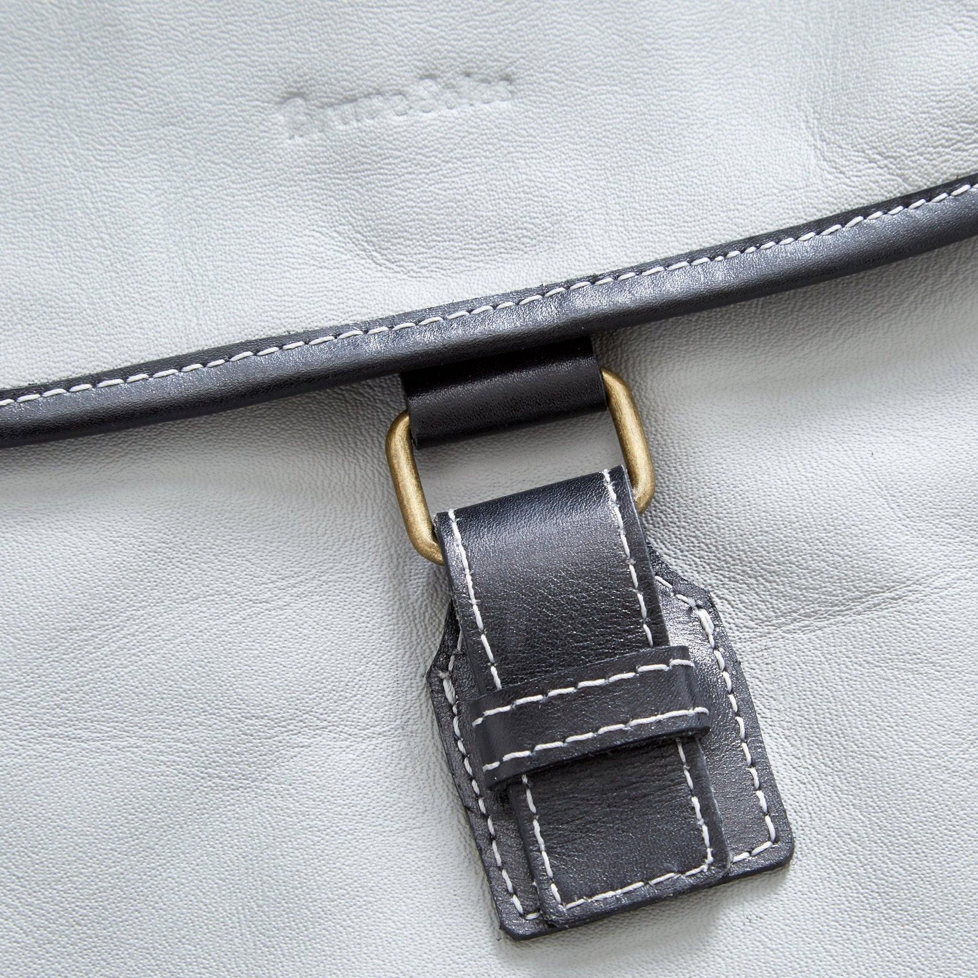Closer view of The Miina Hudson messenger bag made with grey upcycled aircraft leather