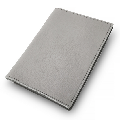 The Miina Eco-friendly pearson passport holder crafted from sustainably sourced materials, featuring a sleek design for secure travel document storage.